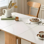 Table pliante 4-6 personnes en bois massif Agatha avec plateau en pierre sintérisée