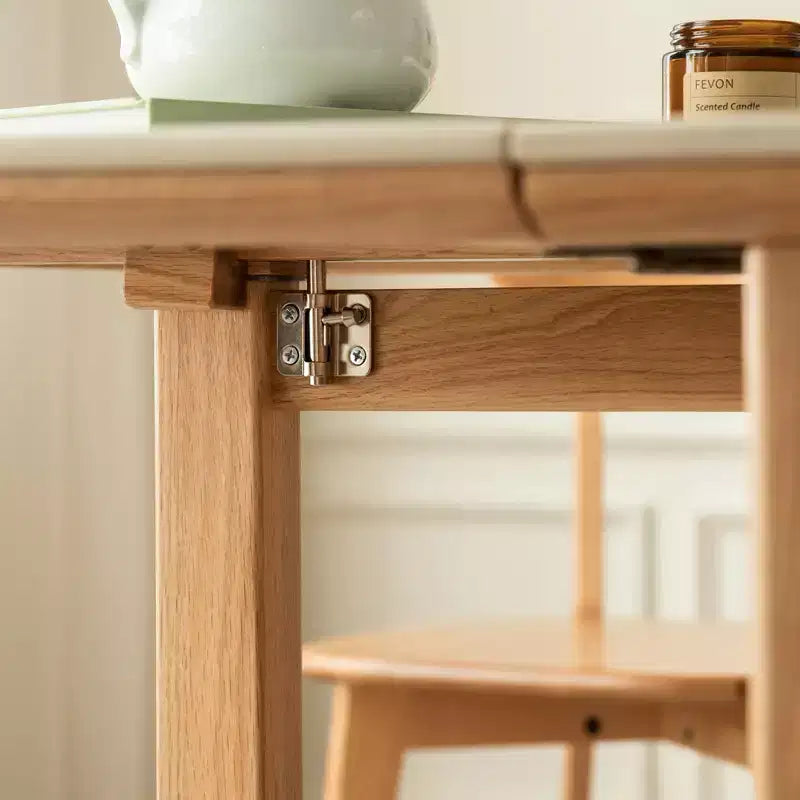 Table pliante 4-6 personnes en bois massif Agatha avec plateau en pierre sintérisée